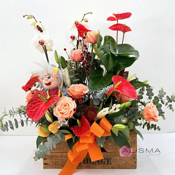 Centro de plantas y flores con peluche 
